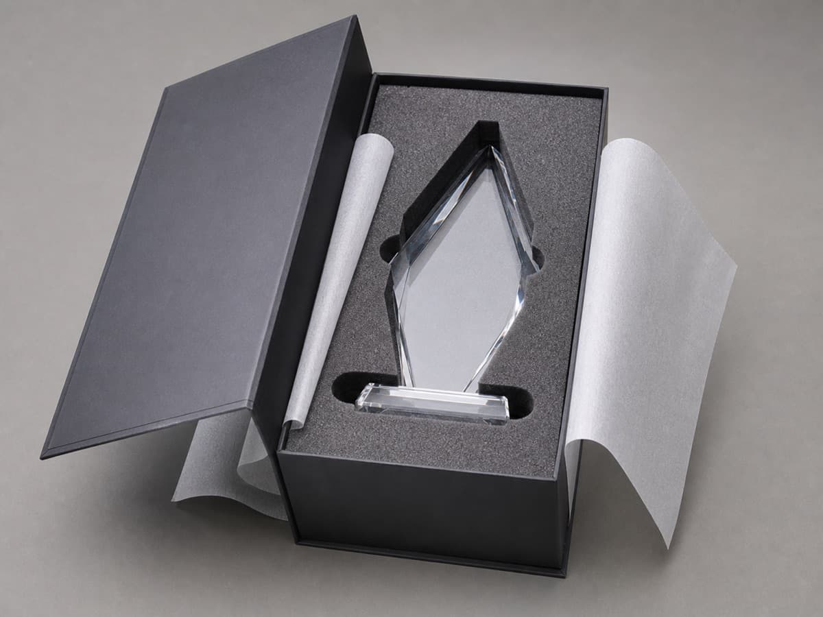 Illustrative fitted foam packing for a faceted crystal award